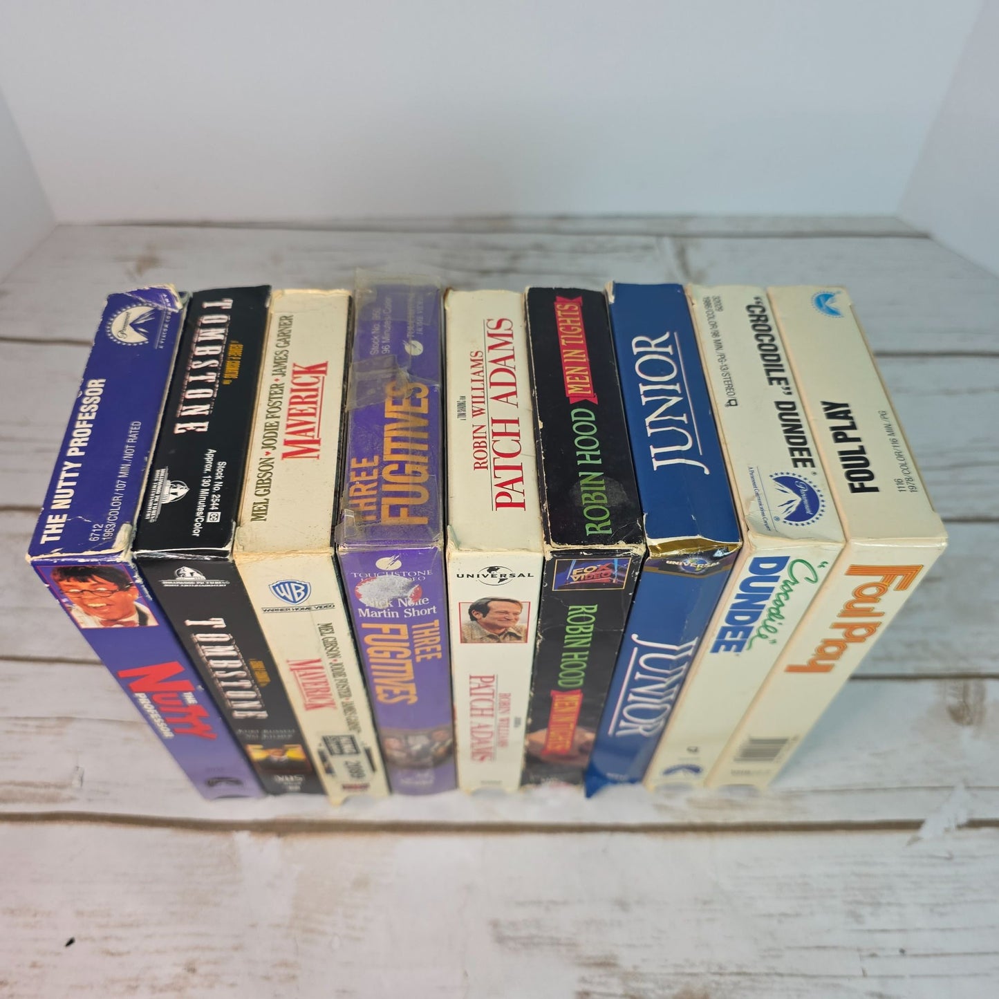 Lot Of 9 VHS Movies Comedy & Western Titles Including Nutty Professor Tombstone Maverick Patch Adams Three Fugitives
