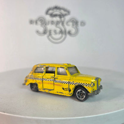 Vintage Hot Wheels London Taxi Yellow Black Checkers London Cab Co. #619 Diecast  I'll