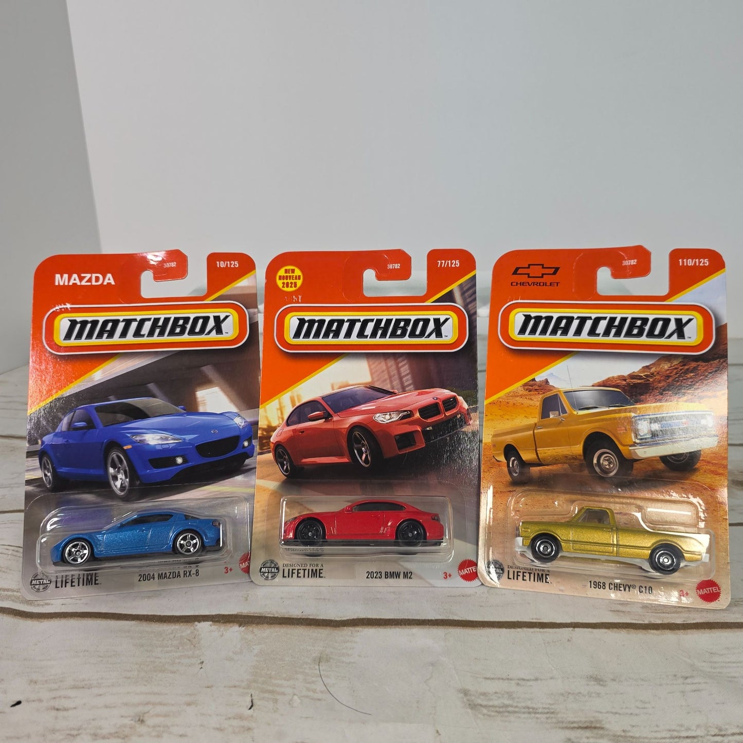 Lot Of 3 Matchbox Die-Cast Cars - 2004 Mazda RX-8 2023 BMW M2 And 1968 Chevy C10