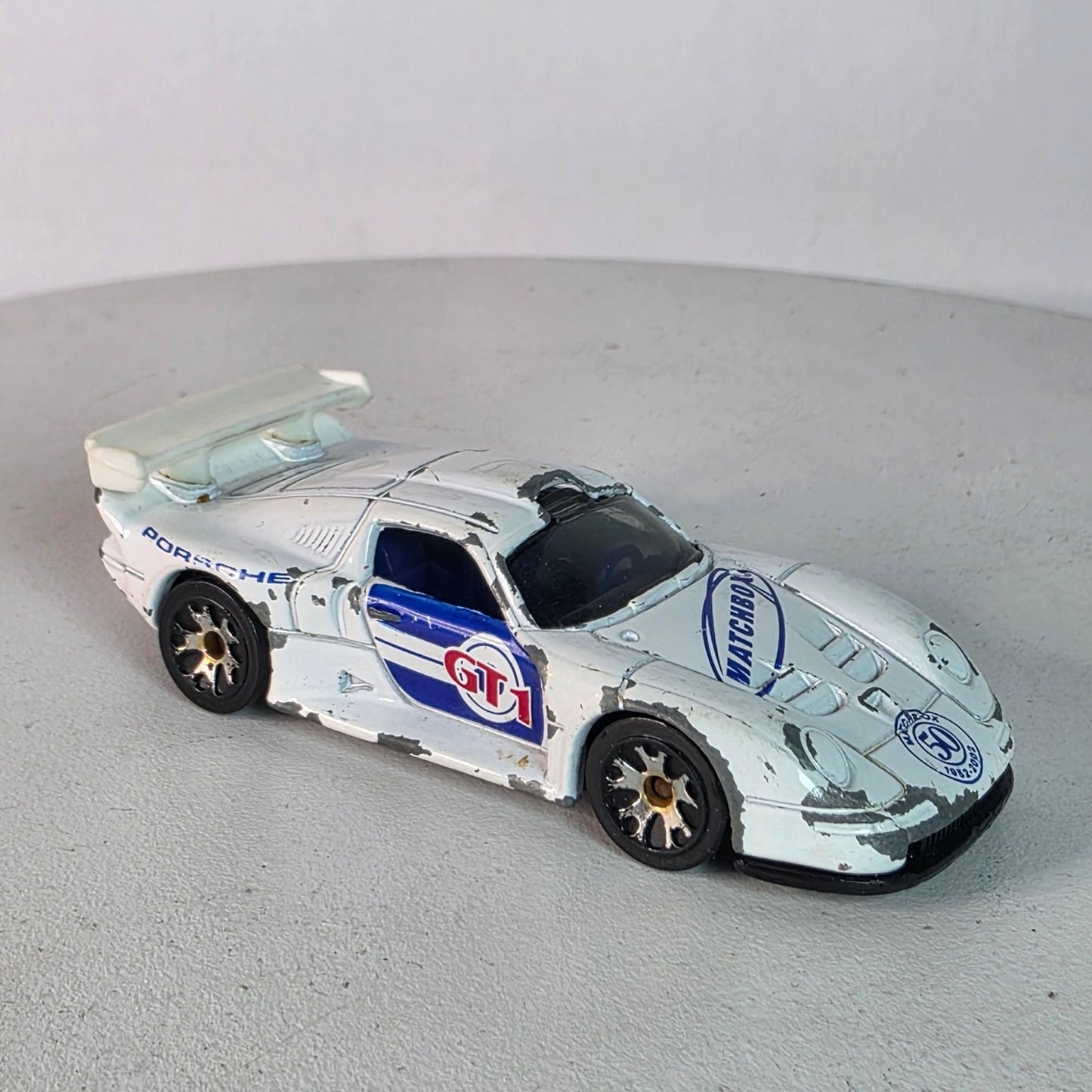 Matchbox Porsche 911 GT1 1998 Casting 2002 50th Anniv White Blue Hood Logo Loose