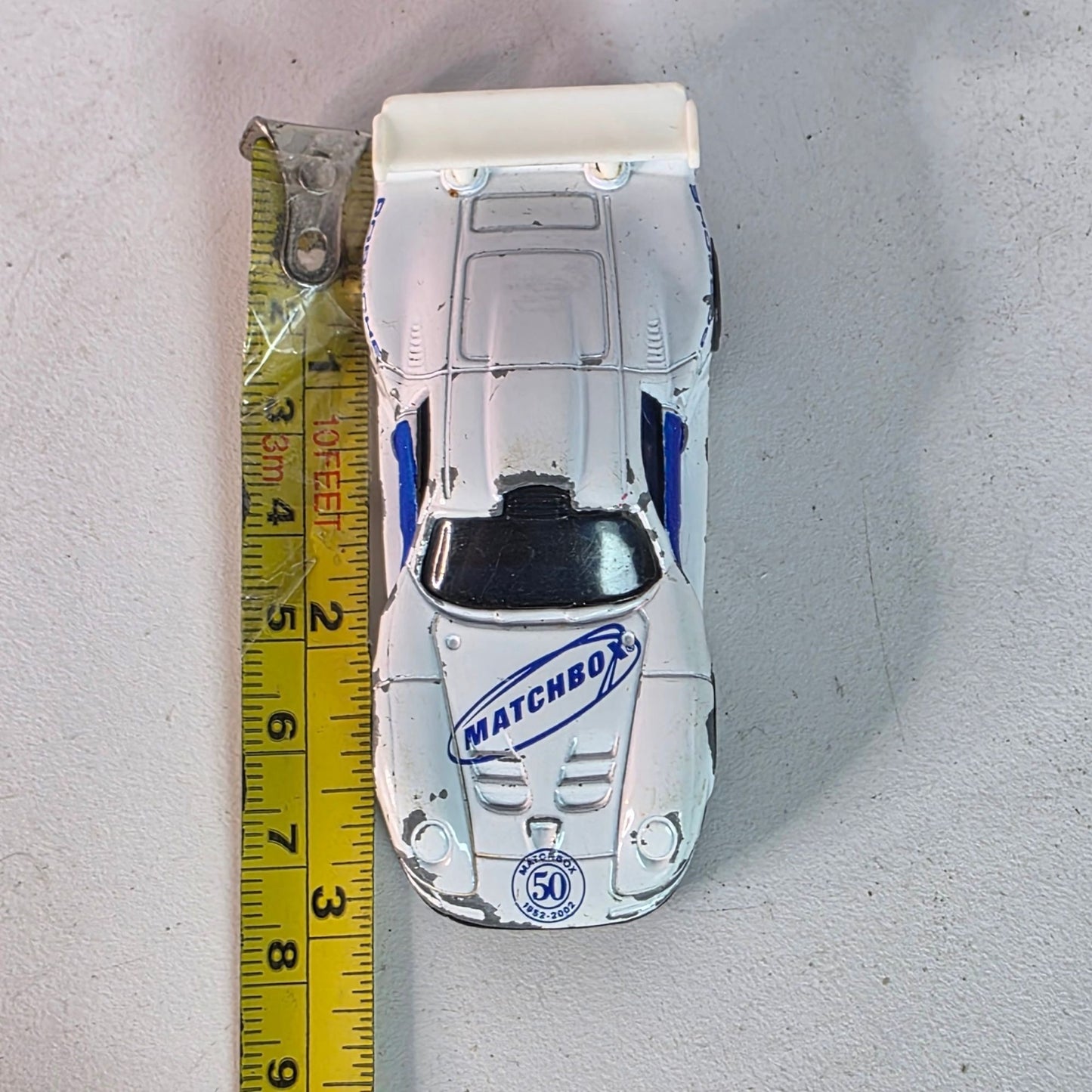 Matchbox Porsche 911 GT1 1998 Casting 2002 50th Anniv White Blue Hood Logo Loose