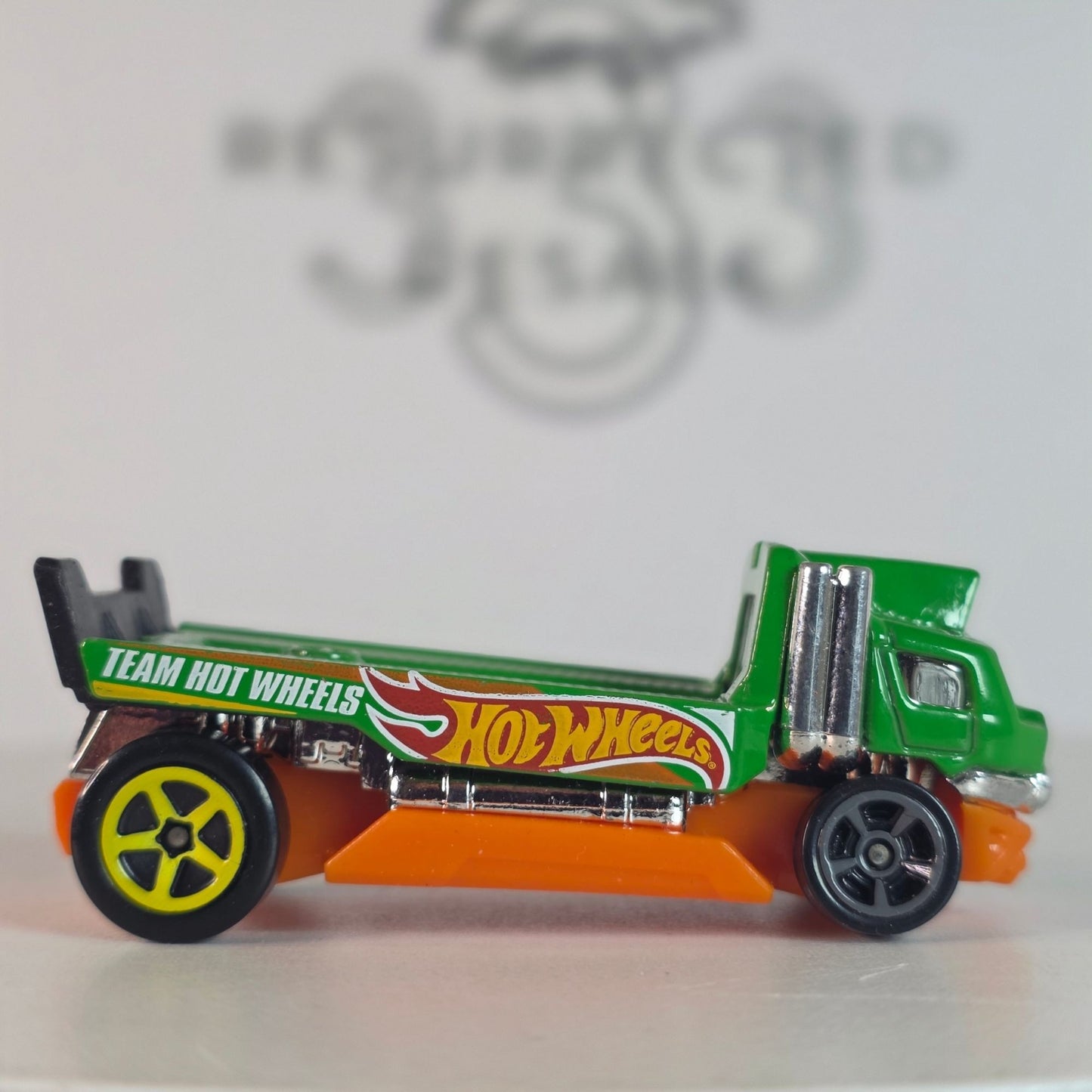 2014 Hot Wheels Haulinator Team Hot Wheels Green Flatbed Truck - Chrome Stacks, Loose NM
