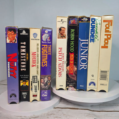 Lot Of 9 VHS Movies Comedy & Western Titles Including Nutty Professor Tombstone Maverick Patch Adams Three Fugitives