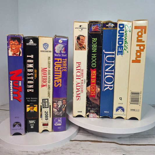 Lot Of 9 VHS Movies Comedy & Western Titles Including Nutty Professor Tombstone Maverick Patch Adams Three Fugitives