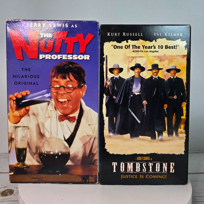 Lot Of 9 VHS Movies Comedy & Western Titles Including Nutty Professor Tombstone Maverick Patch Adams Three Fugitives