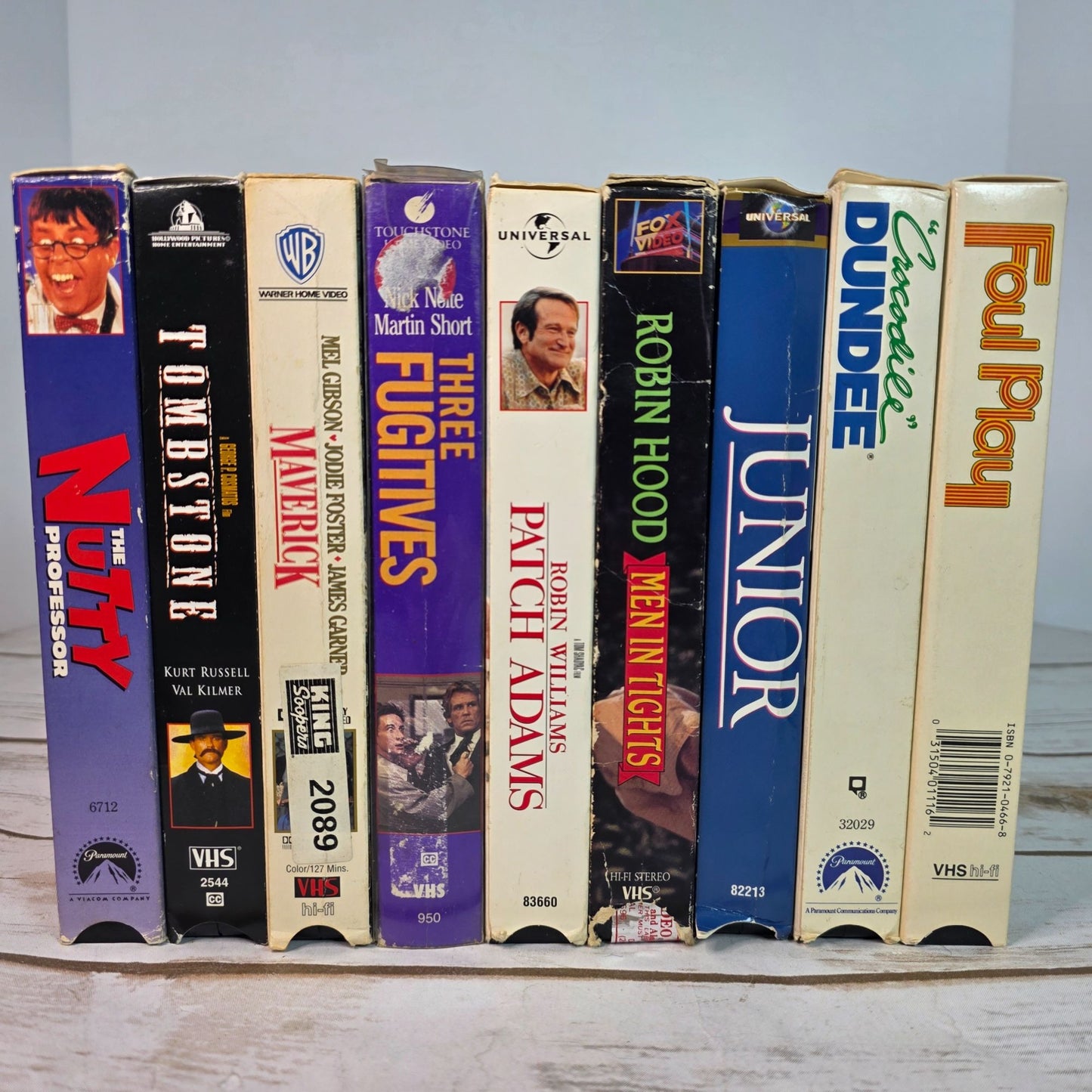 Lot Of 9 VHS Movies Comedy & Western Titles Including Nutty Professor Tombstone Maverick Patch Adams Three Fugitives