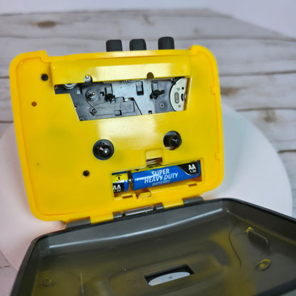 Sports By GPX Cassette Personal Stereo Walkman Style Yellow/Gray Lightweight Portable Music Player With Belt Clip
